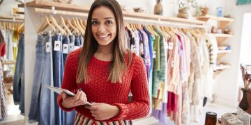 Portrait Of Female Owner Of Independent Clothing And Gift Store With Digital Tablet