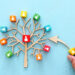 Business image of wooden tree with people icons over blue table, human resources and management concept