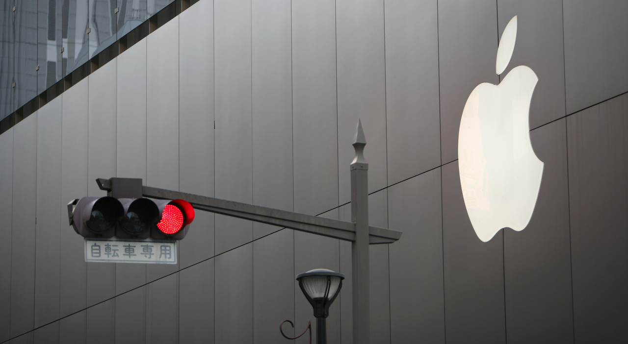 TOKYO, JAPAN - MARCH 24, 2009. Red traffic light before the Apple company building in Ginza district.